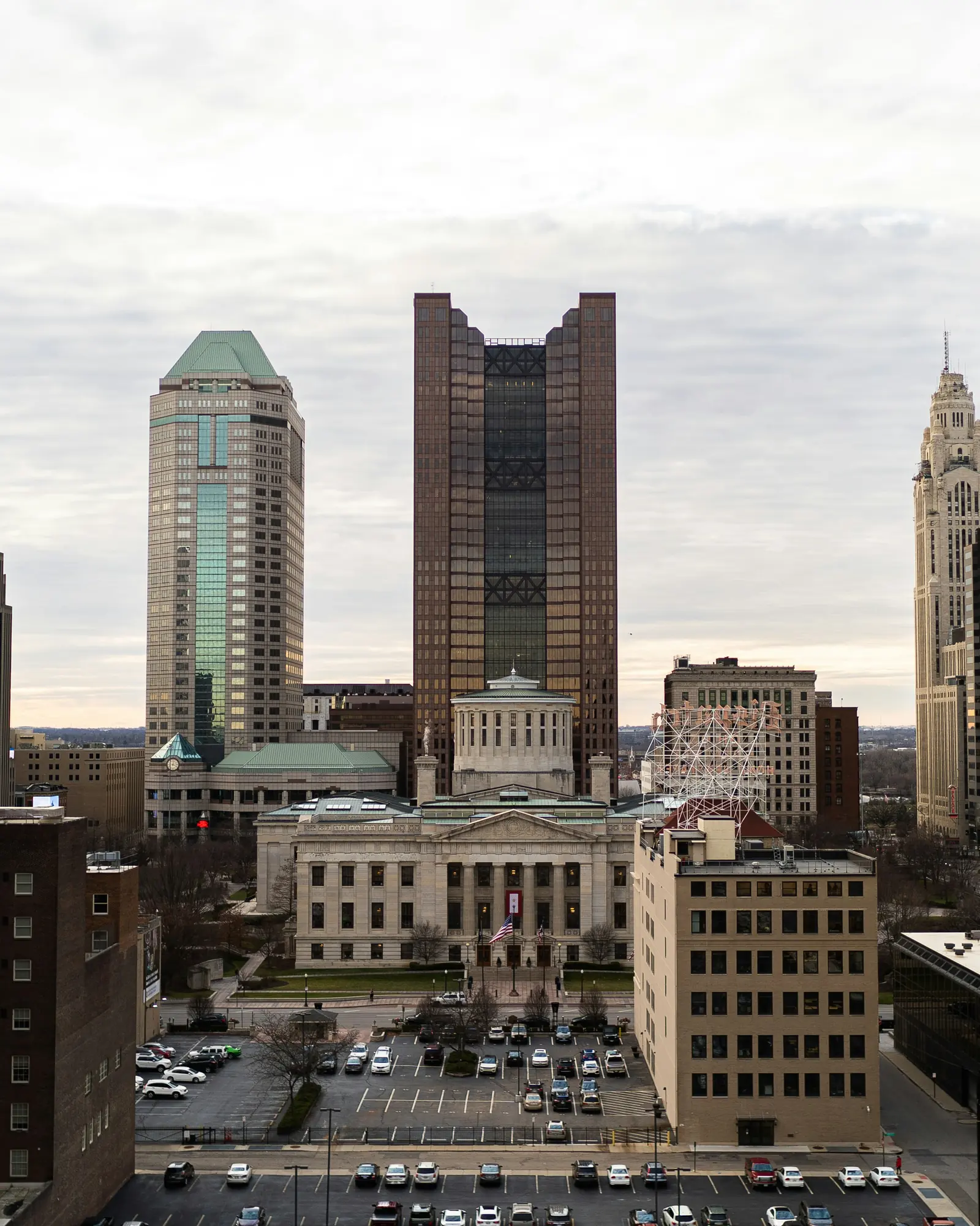 Downtown Columbus, with the Ohio Statehouse in front of high-rise buildings
